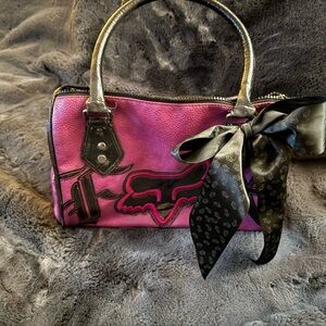 Stylish Pink Handbag with Black Accents